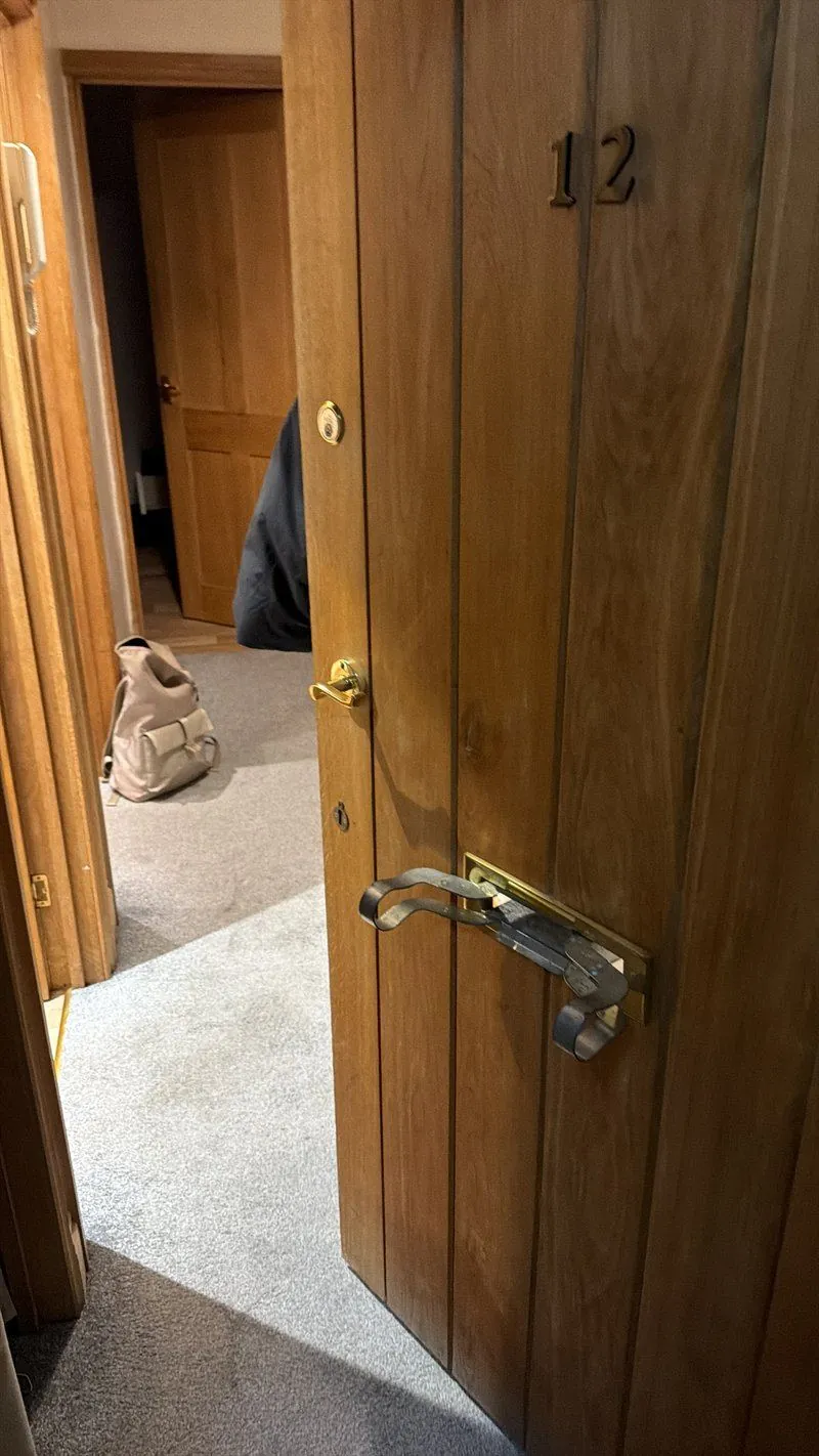 Non-destructive entry tool being used to open a locked door during an emergency lockout