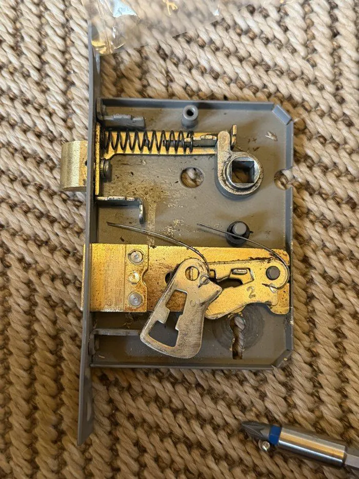 Mortice lock mechanism stripped down for repair rather than full replacement, Chipping Norton