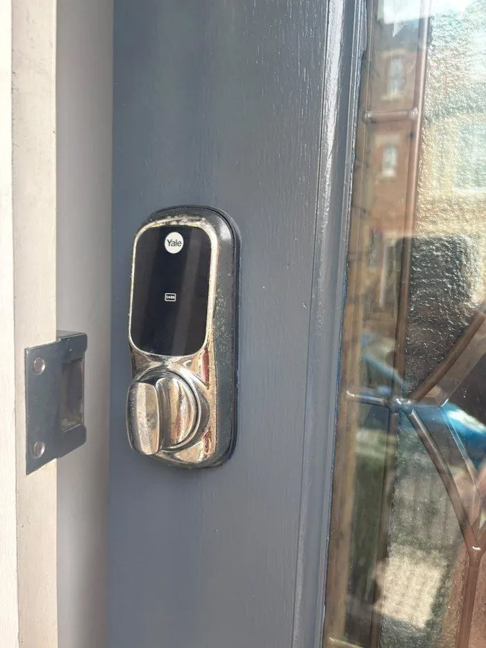 Yale smart lock keyless entry system with card access fitted to a blue front door in Banbury